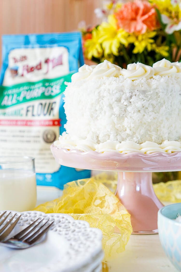 This Classic Coconut Cake is the perfect Easter dessert! Light and fluffy with a cream cheese frosting laced with the essence of sweet coconut!