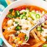  This Slow Cooker Chicken Tortilla Soup is loaded with delicious ingredients like chicken, peppers, tomatoes, corn, and beans and the bold flavor of garlic and cayenne! A comforting and hot meal for chilly nights!
