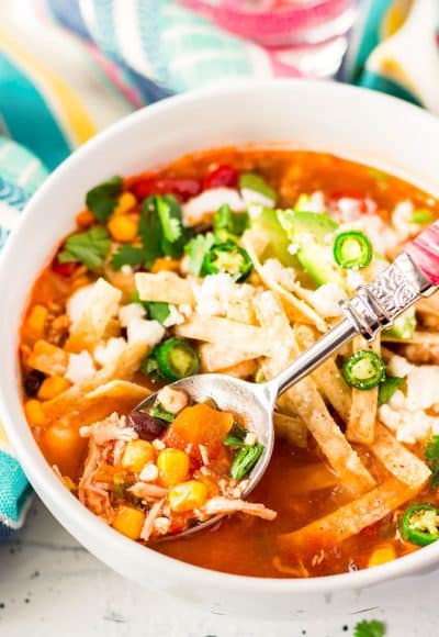  This Slow Cooker Chicken Tortilla Soup is loaded with delicious ingredients like chicken, peppers, tomatoes, corn, and beans and the bold flavor of garlic and cayenne! A comforting and hot meal for chilly nights!