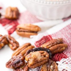 How To Candy Pecans - The Easy Way! These Candied Pecans are a delicious addition to any fall dish. They're perfect on sweet potatoes, pumpkin pies, they also make a lovely addition to salads and yogurt. Or, just eat them straight up!