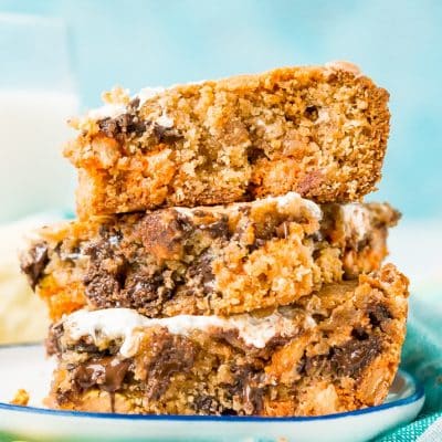 These Peanut Butter Fluff Blondies are a sweet and chewy dessert that's loaded with chocolate chips and Reese's pieces with a marshmallow swirl!