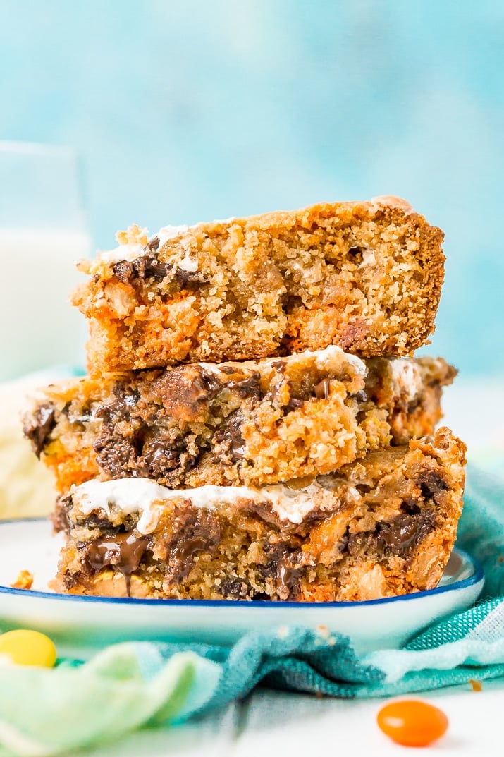 These Peanut Butter Fluff Blondies are a sweet and chewy dessert that's loaded with chocolate chips and Reese's pieces with a marshmallow swirl!