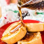 This Eggnog French Toast is dipped in a mixture of eggnog, eggs, rum, vanilla, and nutmeg before it's cooked to perfection and slathered in syrup for a delicious holiday breakfast!