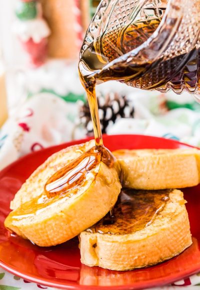 This Eggnog French Toast is dipped in a mixture of eggnog, eggs, rum, vanilla, and nutmeg before it's cooked to perfection and slathered in syrup for a delicious holiday breakfast!