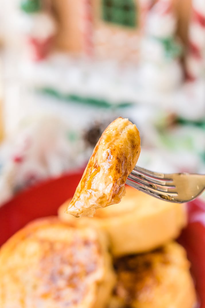 This Eggnog French Toast is dipped in a mixture of eggnog, eggs, rum, vanilla, and nutmeg before it's cooked to perfection and slathered in syrup for a delicious holiday breakfast!