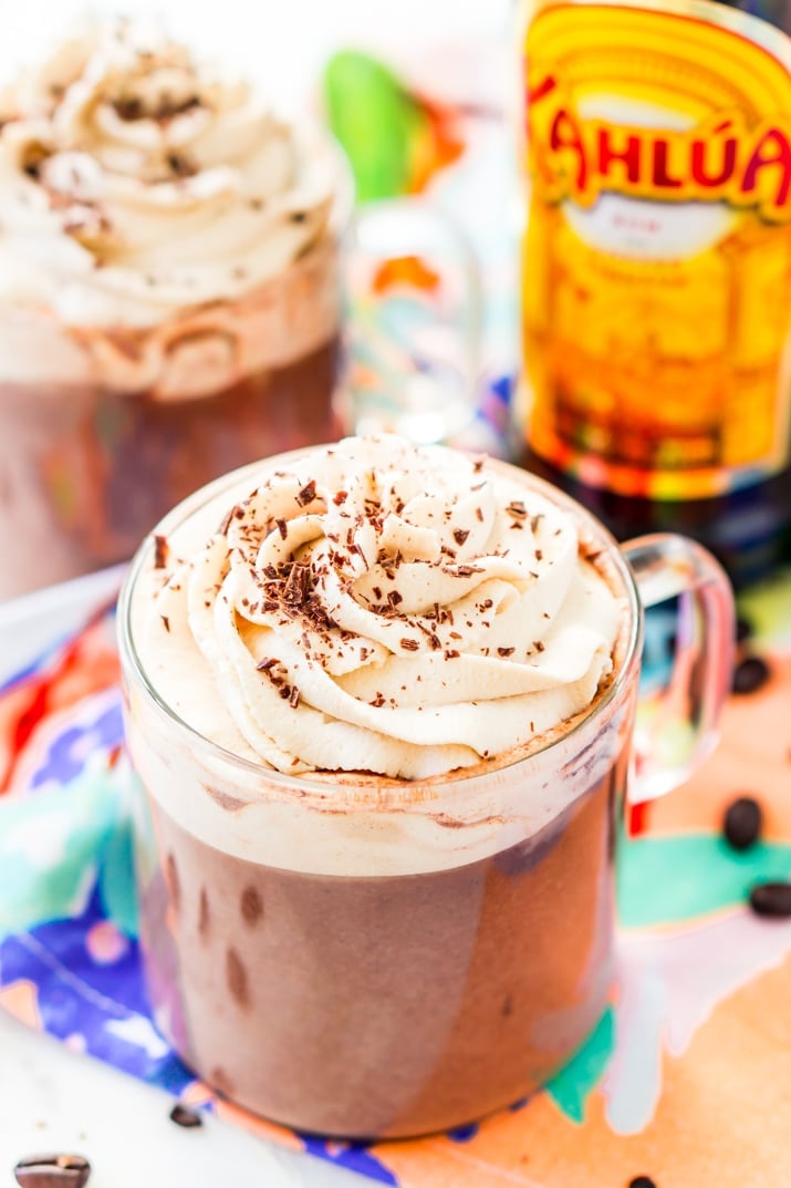 This Kahlua Hot Chocolate is so rich, creamy, and BOOZY! This hot chocolate recipe is laced with coffee liqueur and topped with a Kahlua Whipped Cream and chocolate shavings.