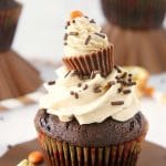 Surprise Chocolate Peanut Butter Cupcakes are moist dark chocolate cupcakes filled with a surprise and topped with silky peanut butter buttercream!