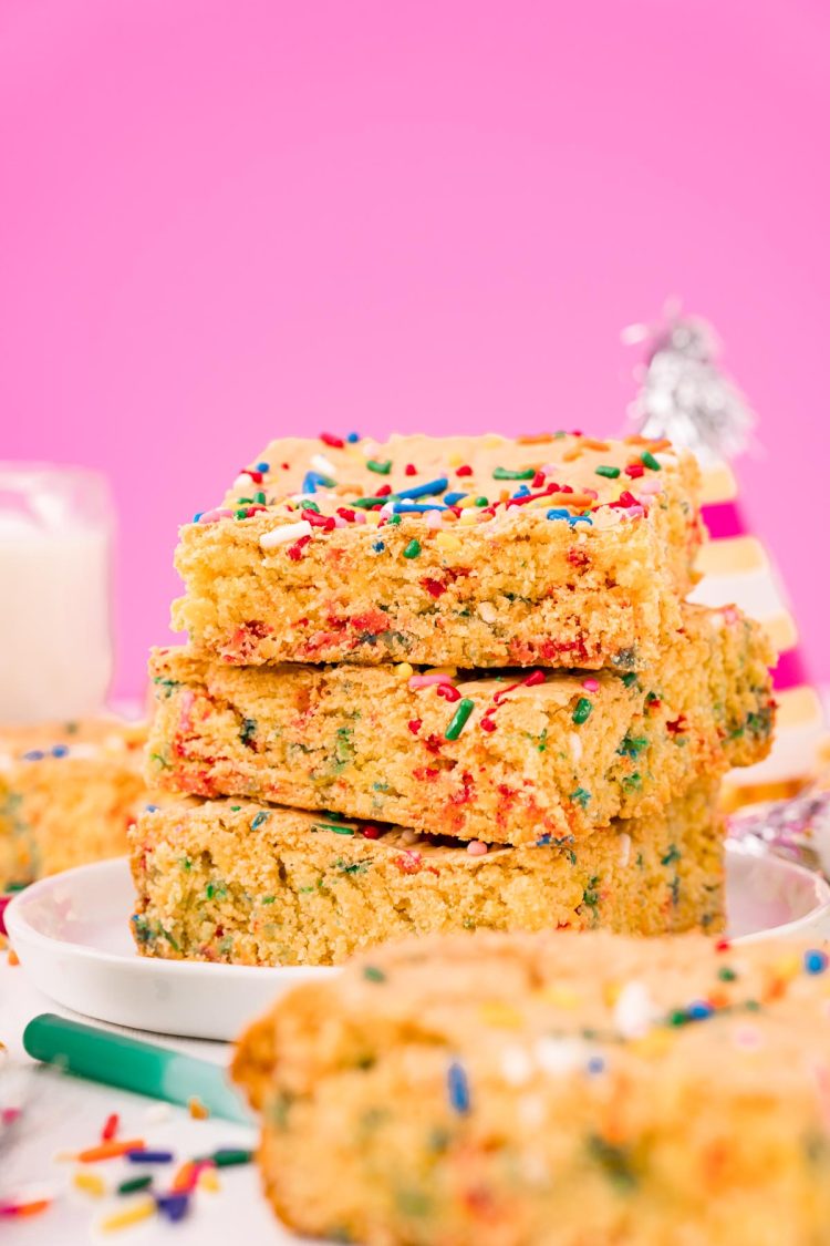 Straight on shot of a stack of three cake mix brownies.