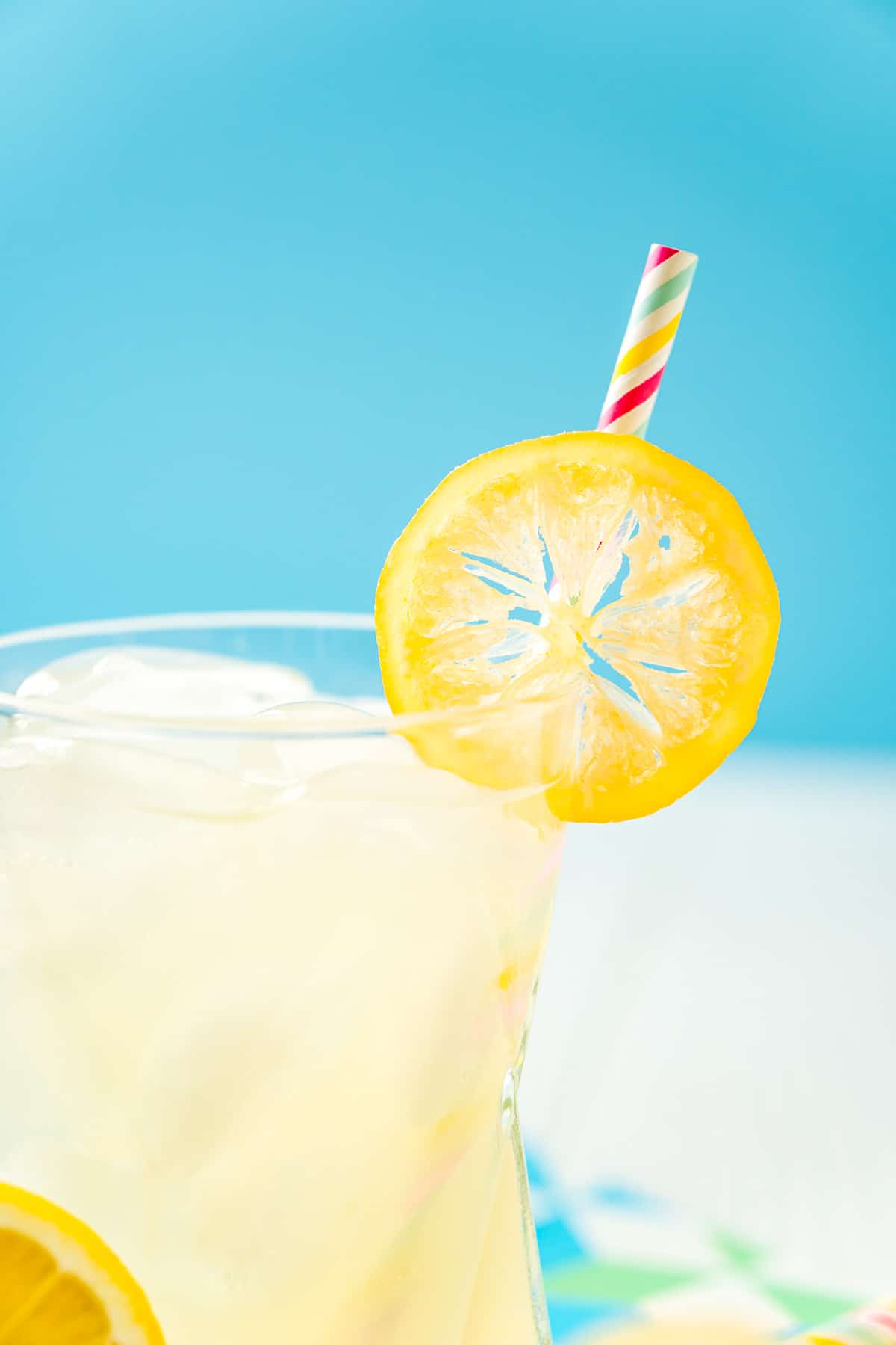 Candied Lemon slice on a glass of lemonade as a garnish.