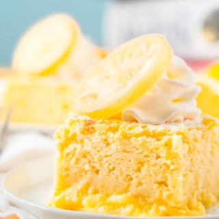 Close up photo of a slice of lemon cake on a small white plate.