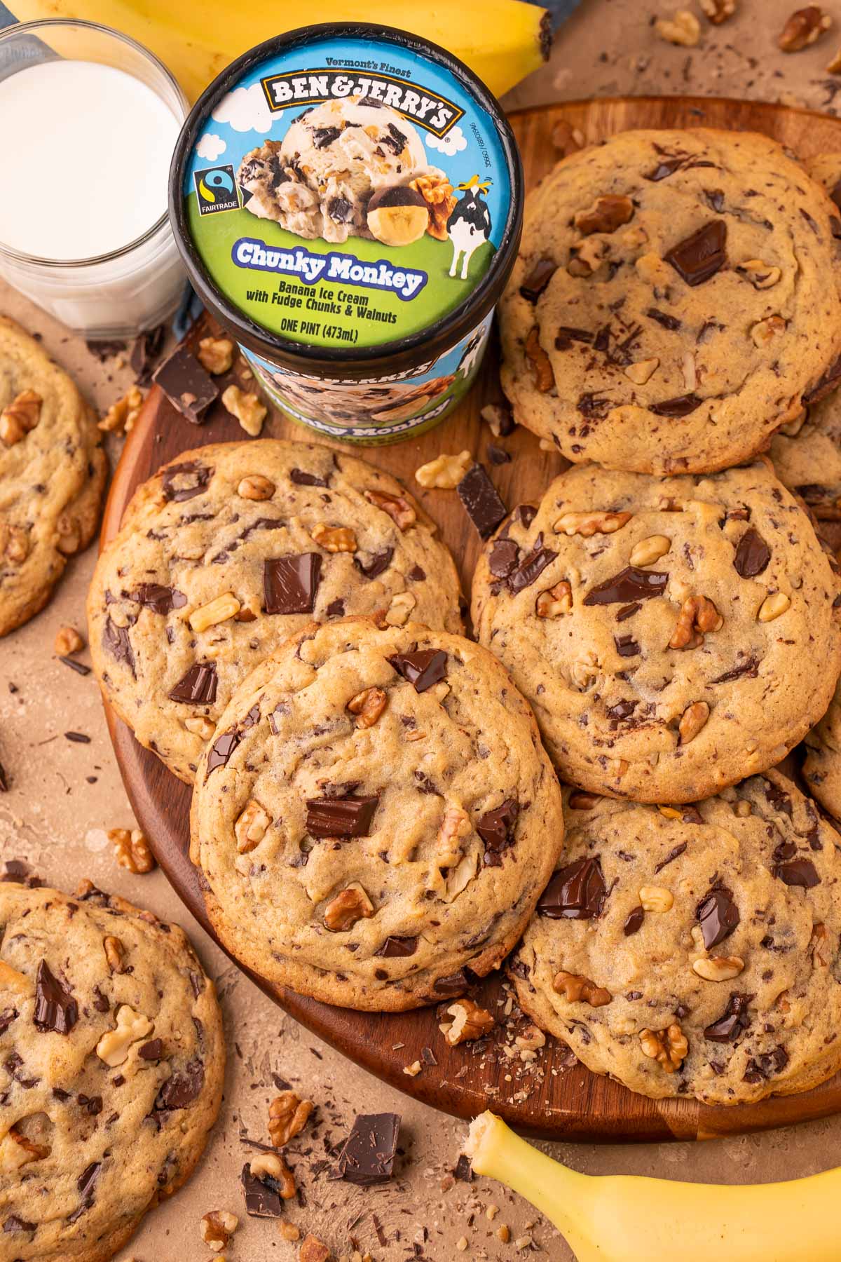 Overhead photo of Chunky Monkey Cookies on a wooden board. 