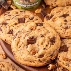 Chunky Monkey Pudding Cookies on a wooden board.