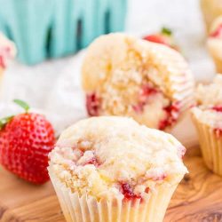 These Strawberry Coffee Cake Muffins are made with sweet fresh berries and buttermilk and topped with a delicious sugar and butter crumble! They're super easy to make and readers have called them the best muffin recipe they've ever had!