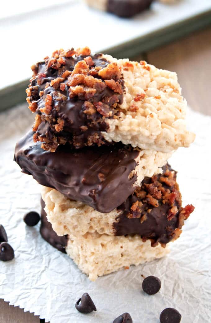 This candied bacon and chocolate dipped rice crispy treats recipe is the perfect twist on a no-bake classic treat - seriously, everything should have a little bacon! via @sugarandsoulco