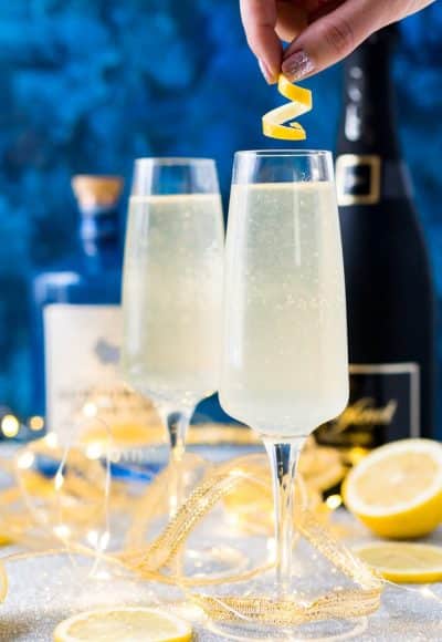 French 75 is a classic cocktail that combines bright citrus with the earthy notes of gin and the sparkle of champagne. A delicious drink recipe for parties, New Year's Eve, brunch, bridal showers and more!