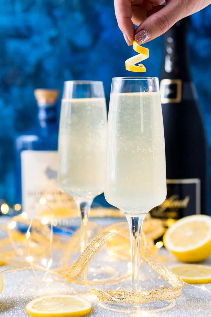 French 75 is a classic cocktail that combines bright citrus with the earthy notes of gin and the sparkle of champagne. A delicious drink recipe for parties, New Year's Eve, brunch, bridal showers and more!