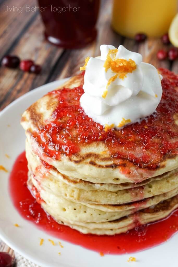 These Orange Ricotta Pancakes are light and fluffy, top them with Cranberry Orange Bourbon Syrup and you're in for some breakfast bliss!