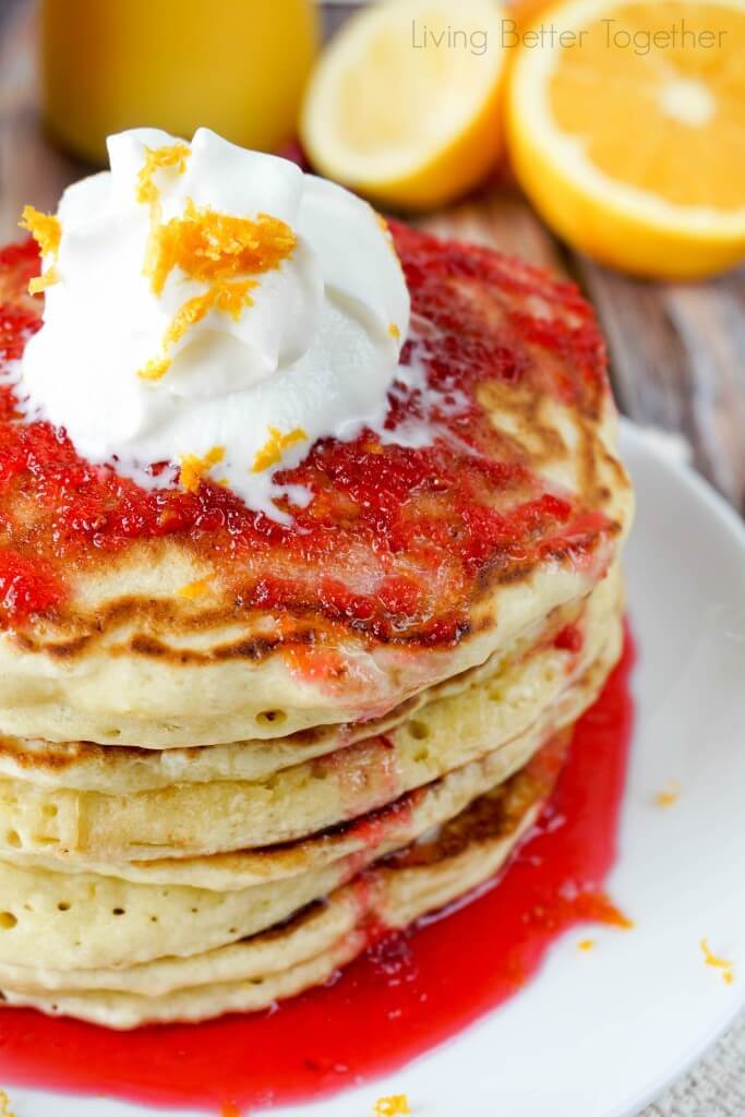 These Orange Ricotta Pancakes are light and fluffy, top them with Cranberry Orange Bourbon Syrup and you're in for some breakfast bliss!