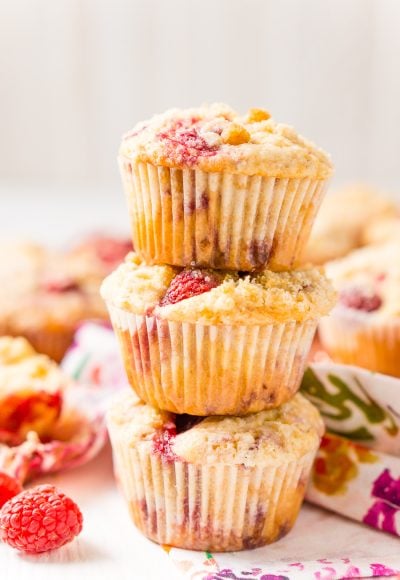 Raspberry Muffins loaded with juicy red raspberries and topped with an irresistible sugar crumble.