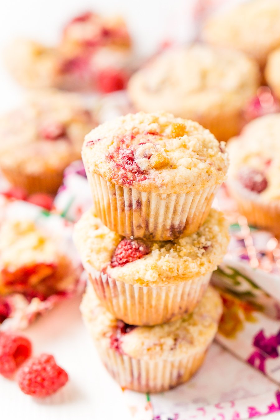 Raspberry Muffins loaded with juicy red raspberries and topped with an irresistible sugar crumble.