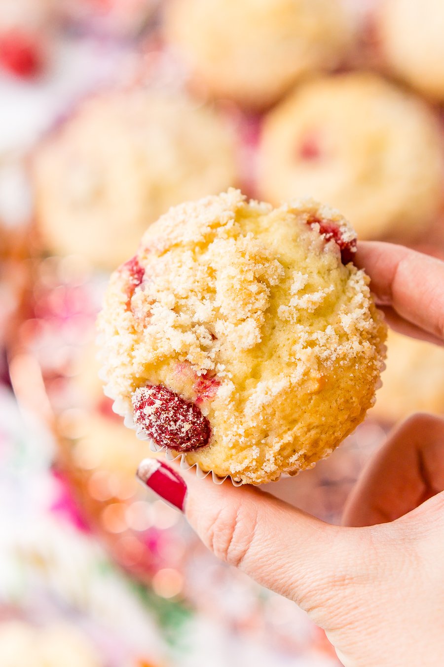 Raspberry Muffins loaded with juicy red raspberries and topped with an irresistible sugar crumble.