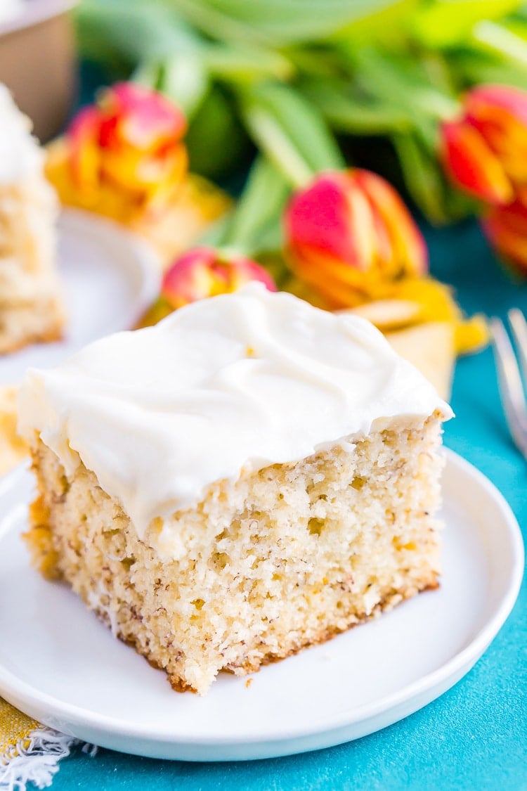 This is the Best Banana Cake recipe EVER! It's moist and sweet and topped with a tangy cream cheese frosting!