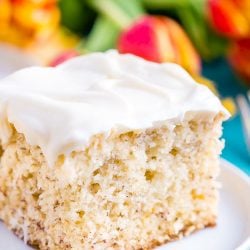 This is the Best Banana Cake recipe EVER! It's moist and sweet and topped with a tangy cream cheese frosting!