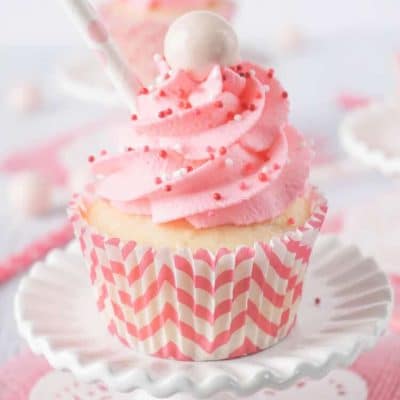 These Strawberry Milkshake Cupcakes have a vanilla malt base and are topped with a strawberry milk whipped cream frosting, sprinkles, and a whopper! Make them for an instant trip down memory lane.