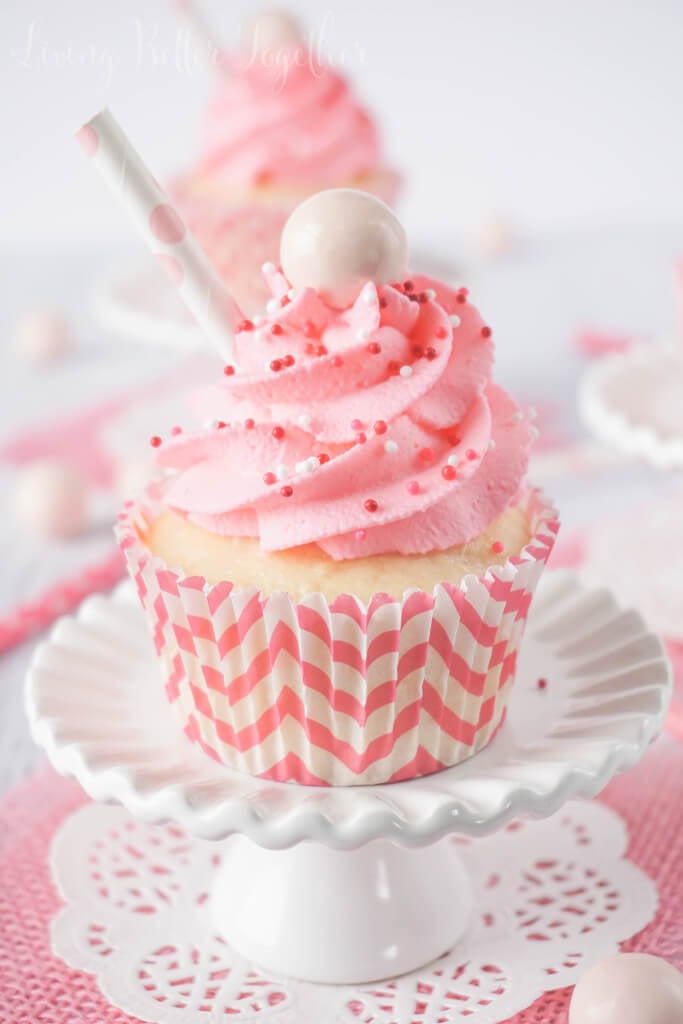 These Strawberry Milkshake Cupcakes have a vanilla malt base and are topped with a strawberry milk whipped cream frosting, sprinkles, and a whopper! Make them for an instant trip down memory lane.