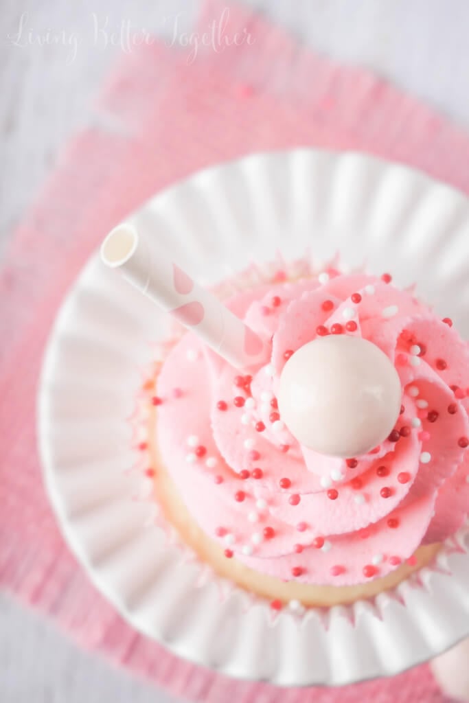 These Strawberry Milkshake Cupcakes have a vanilla malt base and are topped with a strawberry milk whipped cream frosting, sprinkles, and a whopper! Make them for an instant trip down memory lane.