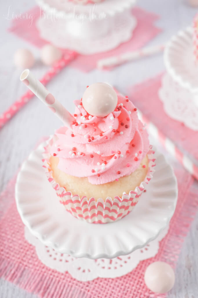 These Strawberry Milkshake Cupcakes have a vanilla malt base and are topped with a strawberry milk whipped cream frosting, sprinkles, and a whopper! Make them for an instant trip down memory lane.