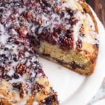 Triple Berry Coffee Cake with a slice missing