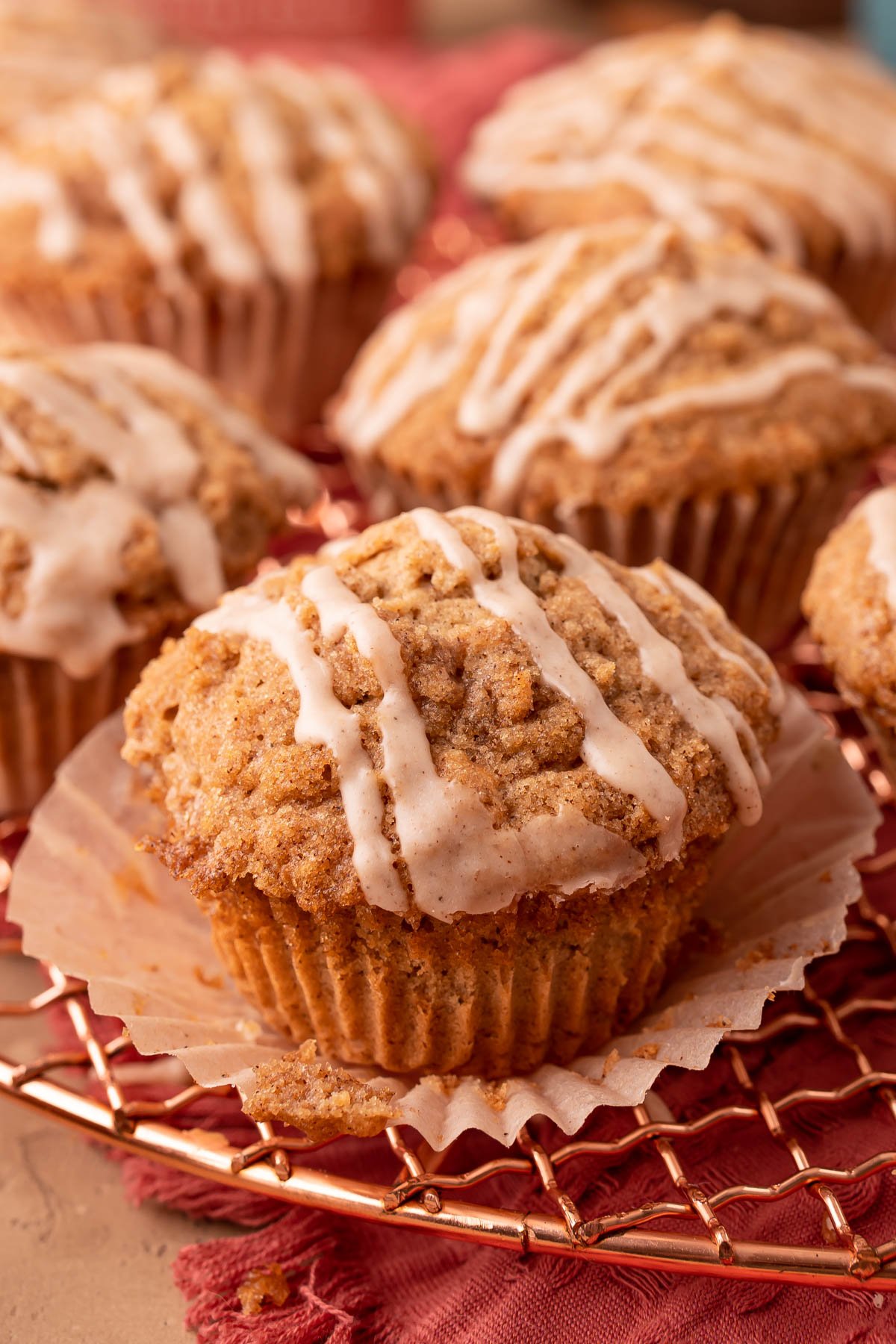 Close up of vanilla chai muffins on a copper wire rack.