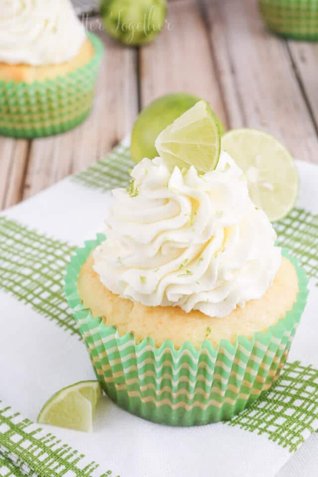 These Key Lime Pie Cupcakes are light and fluffy, filled with sweet key lime curd and topped with a whipped vanilla lime frosting!