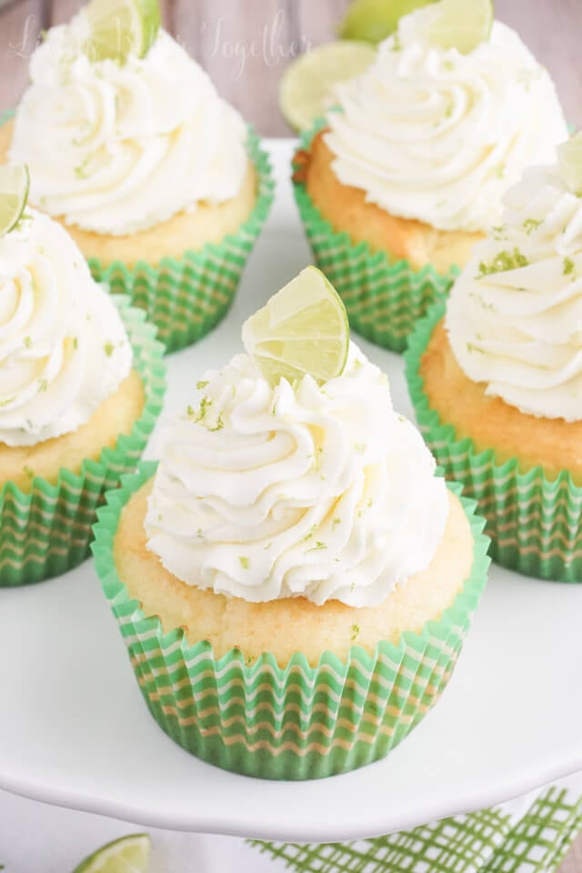 These Key Lime Pie Cupcakes are light and fluffy, filled with sweet key lime curd and topped with a whipped vanilla lime frosting!