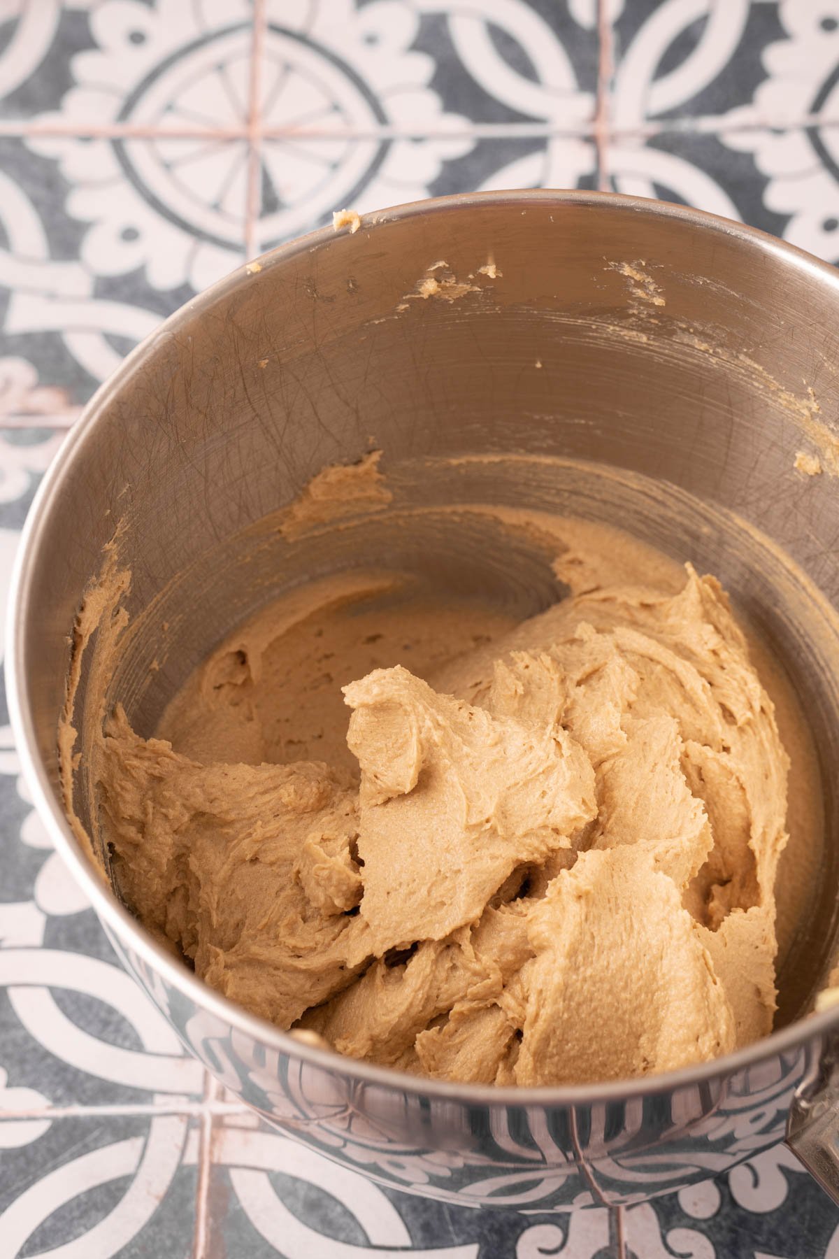 Cookie dough base in a stainless steel mixing bowl.