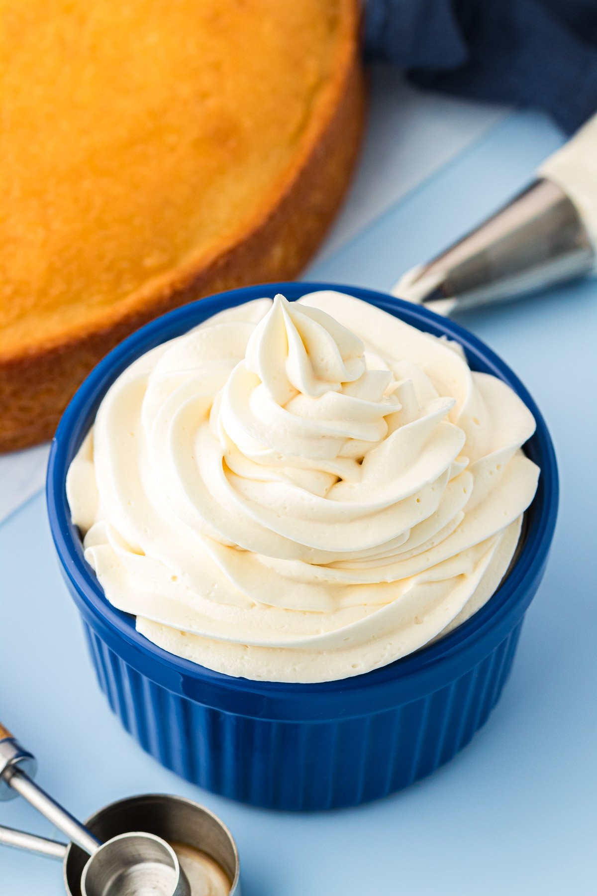 Vanilla Frosting piped into a blue bowl.