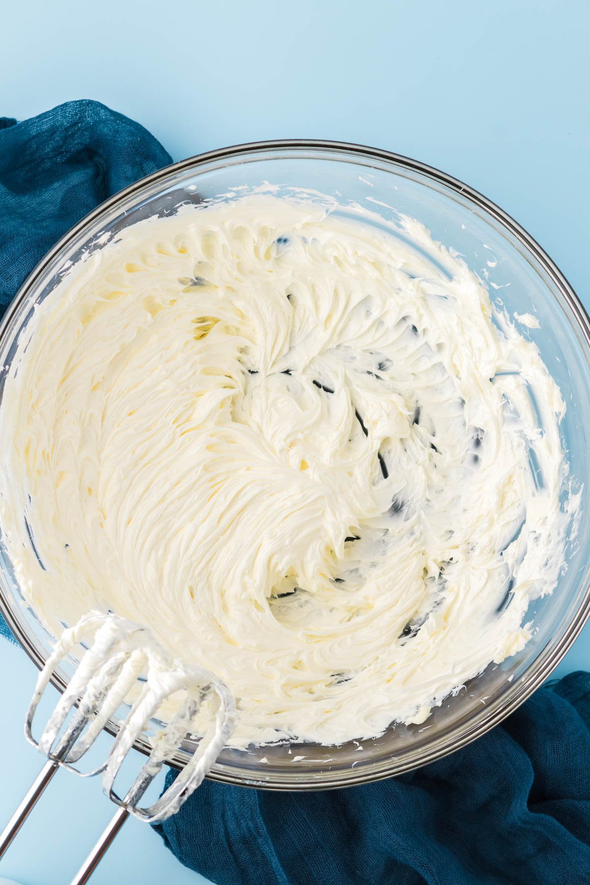 Creamed butter in a large glass bowl.