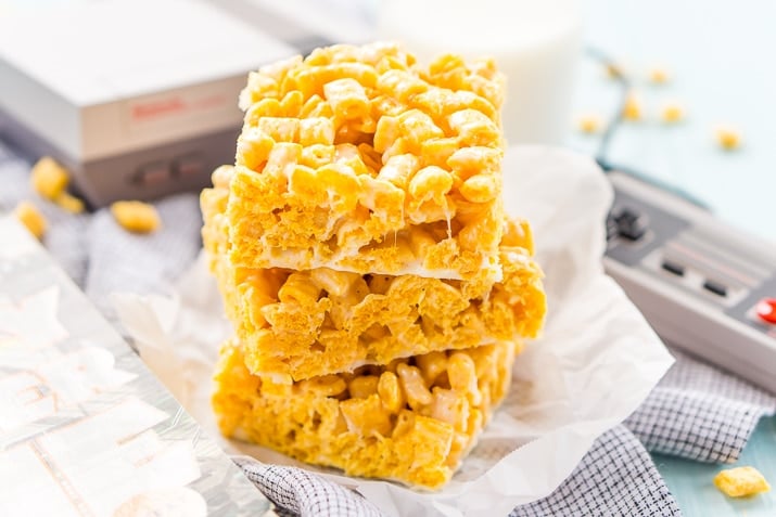 These Cap'n Crunch Treats are a fun twist on classic rice krispies treats and inspired by the book Ready Player One by Ernest Cline. They're the perfect fast dessert or afternoon snack and Cap'n Crunch lovers will go crazy over them!