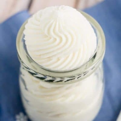 This Classic Vanilla Buttercream Frosting is amazing! It's made with just 5-ingredients and crusts to perfection! Plus, there's no egg whites so you can lick the beaters!