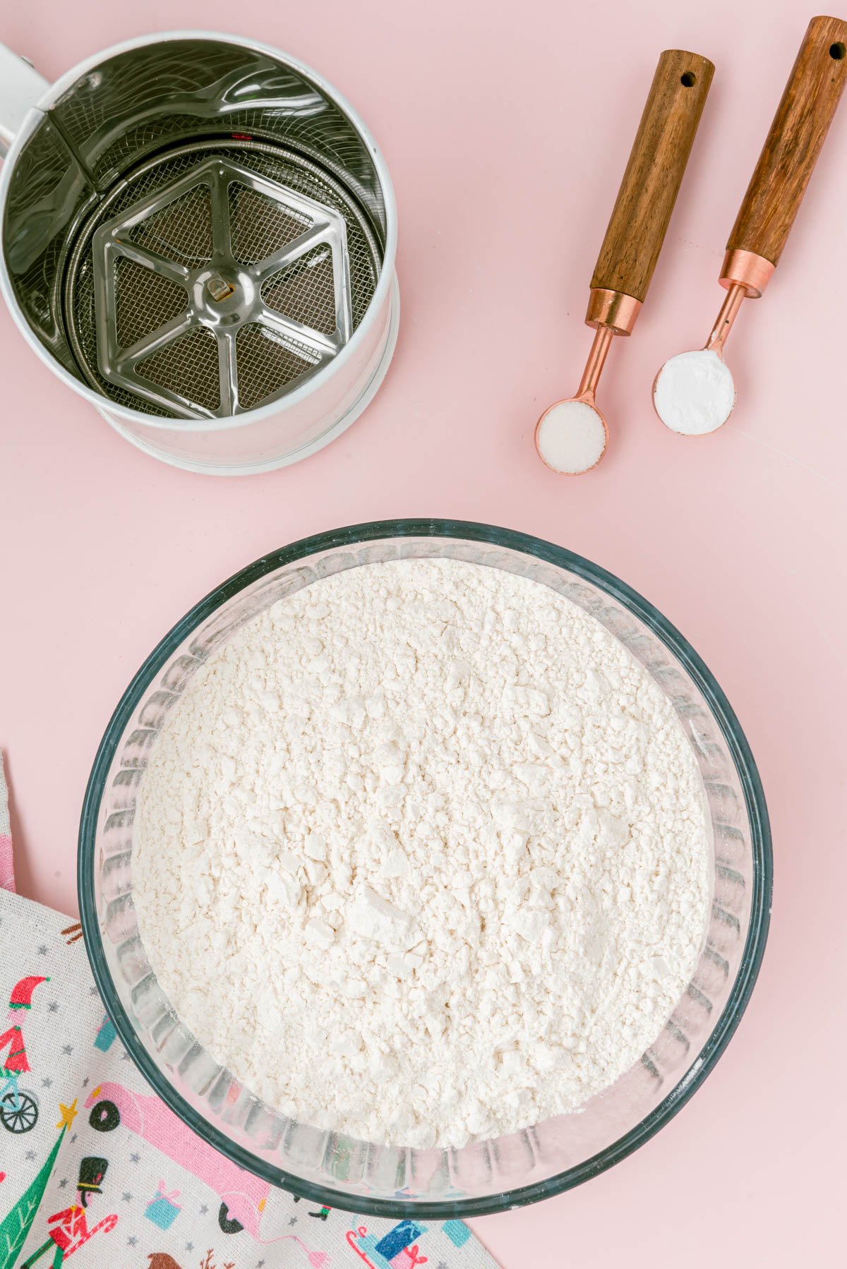 Dry ingredients to make sugar cookies on a table.