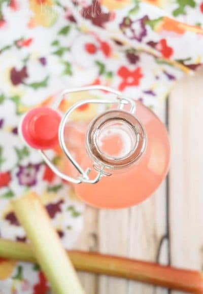 This 3-Ingredient Rhubarb Simple Syrup is the perfect addition to summer drinks, cakes, and ice cream. Plus, it's super easy to make!