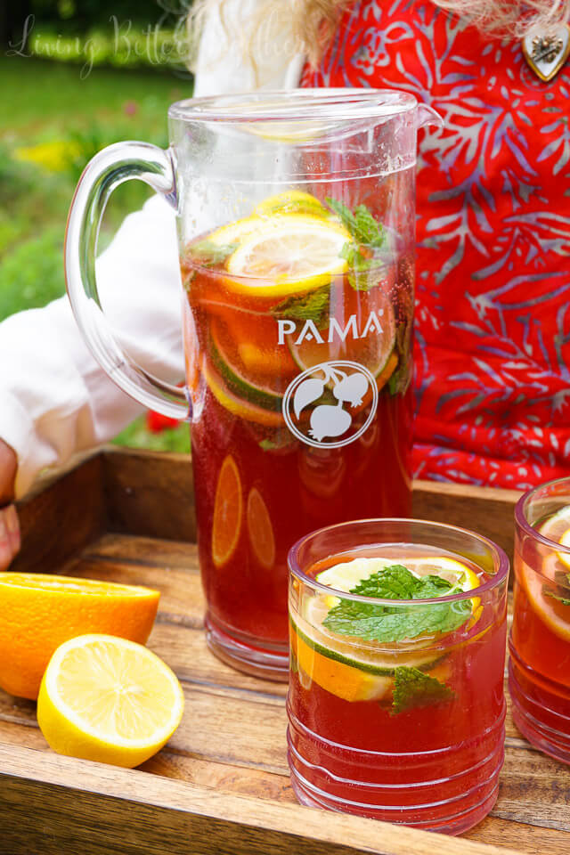 Celebrate summer with this Pomegranate Citrus Rum Punch! Sweet PAMA Pomegranate Liqueur paired with lemonade, lemon lime soda, and rum for a splash of summer fun. Plus a recipe video!