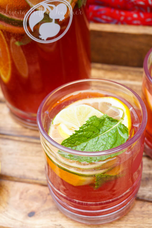 Celebrate summer with this Pomegranate Citrus Rum Punch! Sweet PAMA Pomegranate Liqueur paired with lemonade, lemon lime soda, and rum for a splash of summer fun. Plus a recipe video!