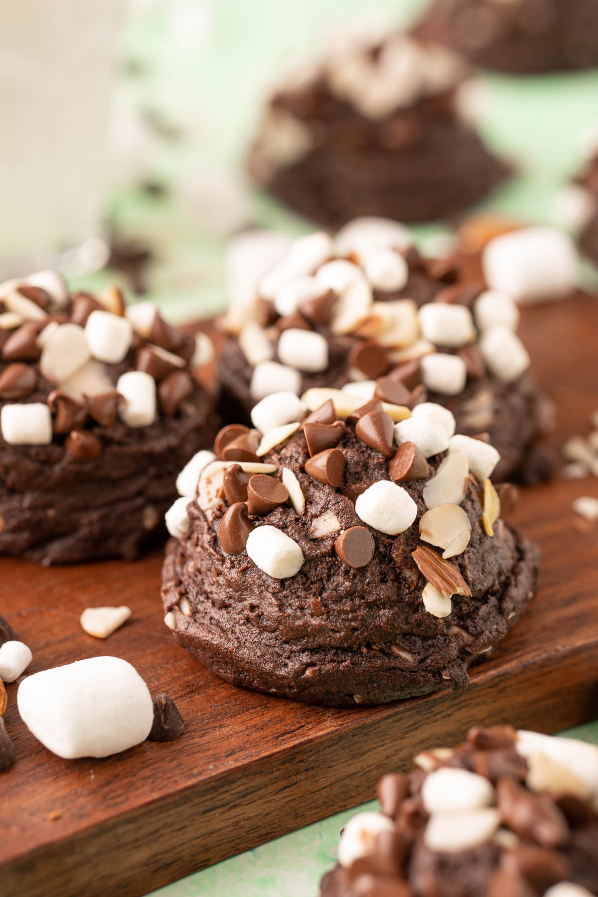 Rocky Road Cookies on a wooden serving board.