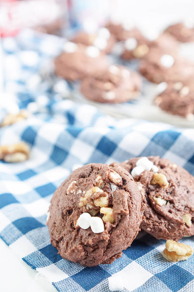 These Rocky Road Pudding Cookies are loaded up with chocolate chips, walnuts, and marshmallows and have a soft and chewy brownie-like center!