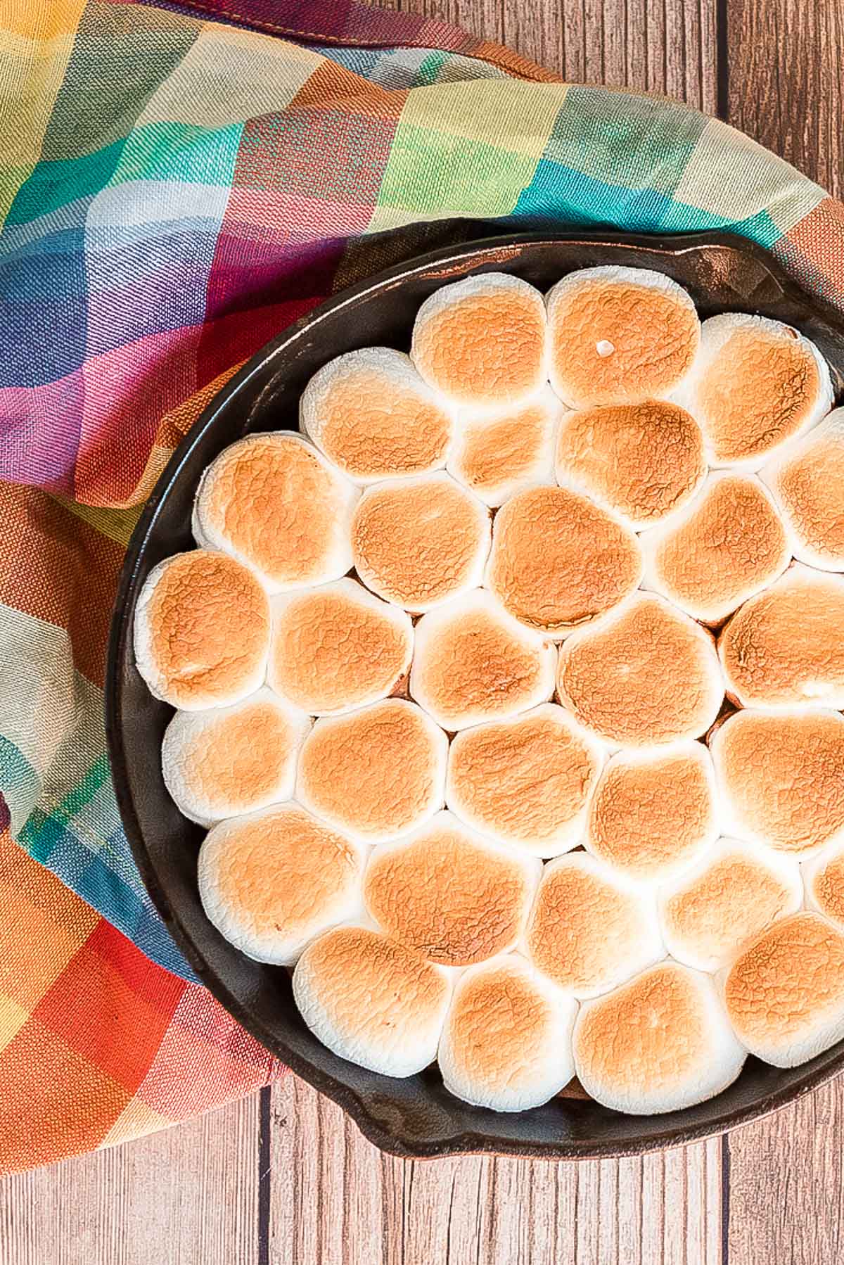 Overhead photo of a cast iron pan filled with s'mores dip.