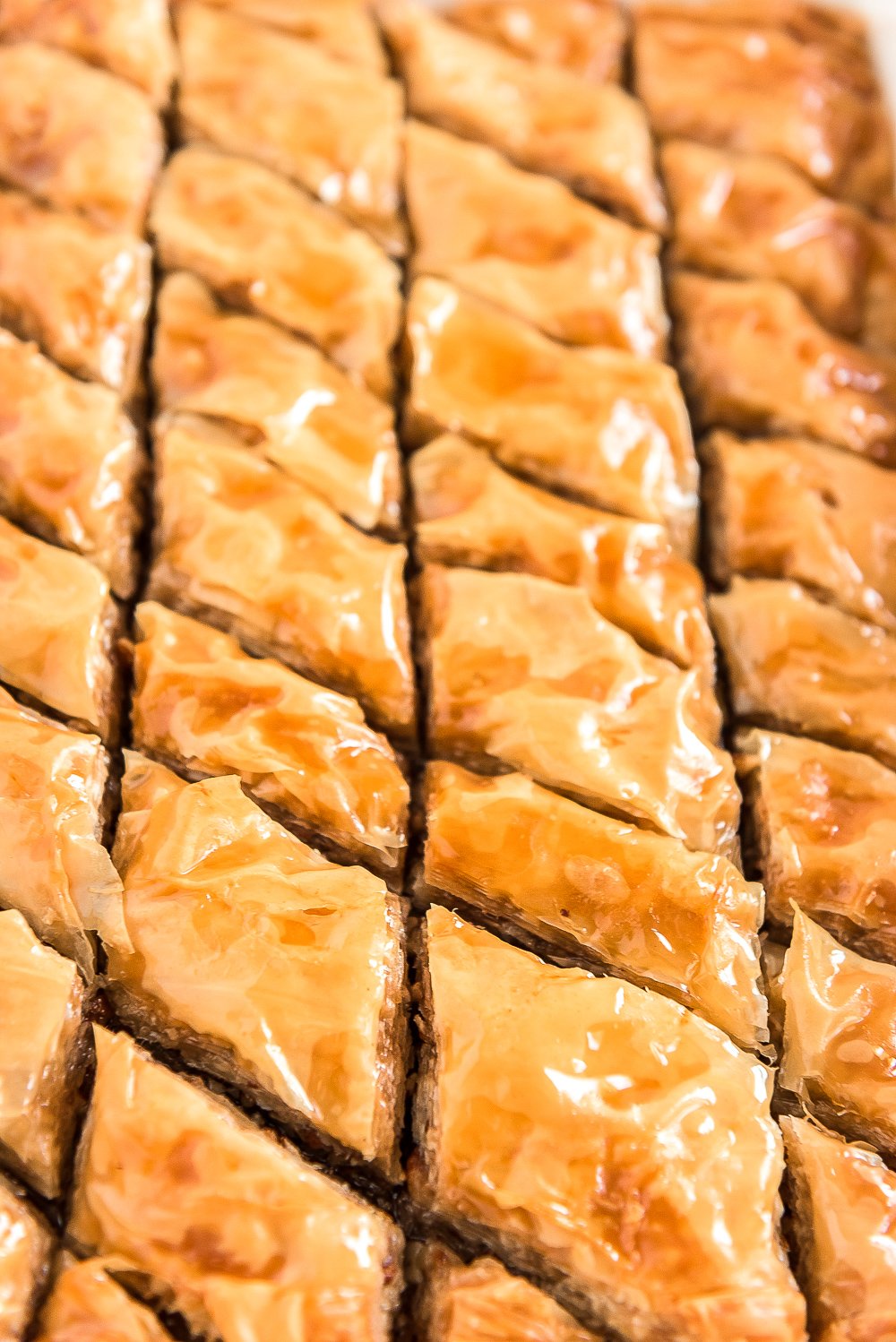 Close up photo of sliced baklava still in baking dish.