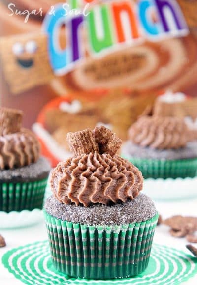 These Chocolate Cinnamon Toast Crunch Cupcakes are everything you loved about childhood rolled up into one! Moist chocolate cake loaded up with cinnamon and topped with a whipped chocolate frosting laced with cereal pieces!