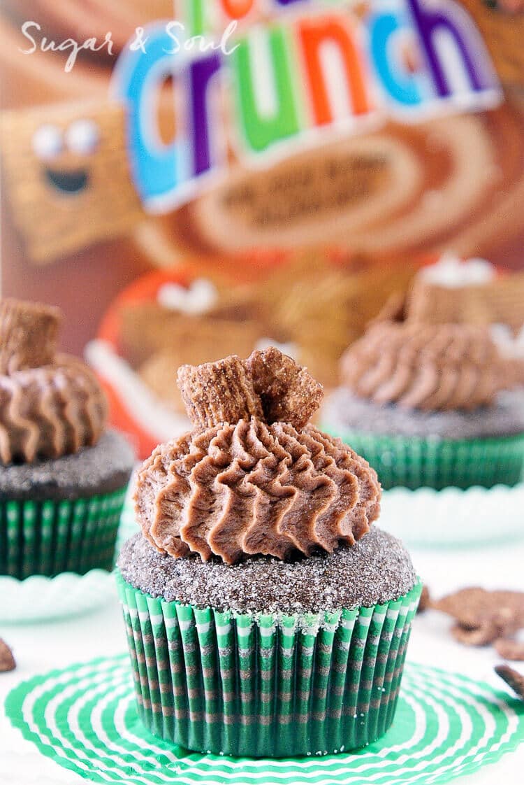 These Chocolate Cinnamon Toast Crunch Cupcakes are everything you loved about childhood rolled up into one! Moist chocolate cake loaded up with cinnamon and topped with a whipped chocolate frosting laced with cereal pieces!